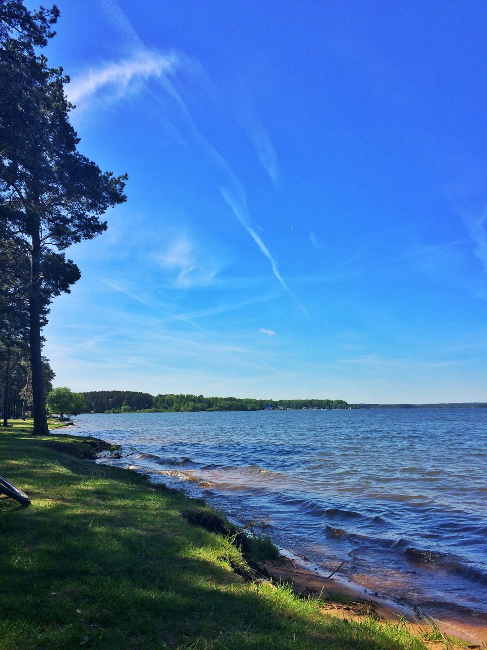 Scenic view of beach and sea against blue sky