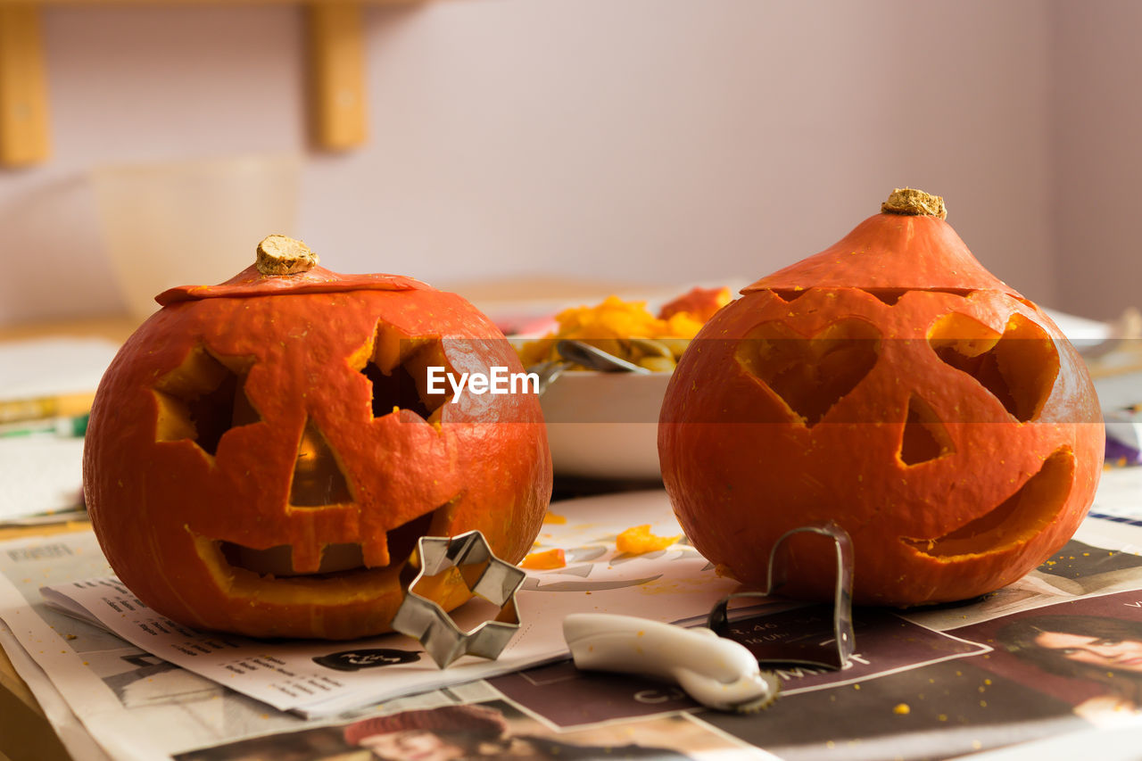 Carved pumpkins on table during halloween