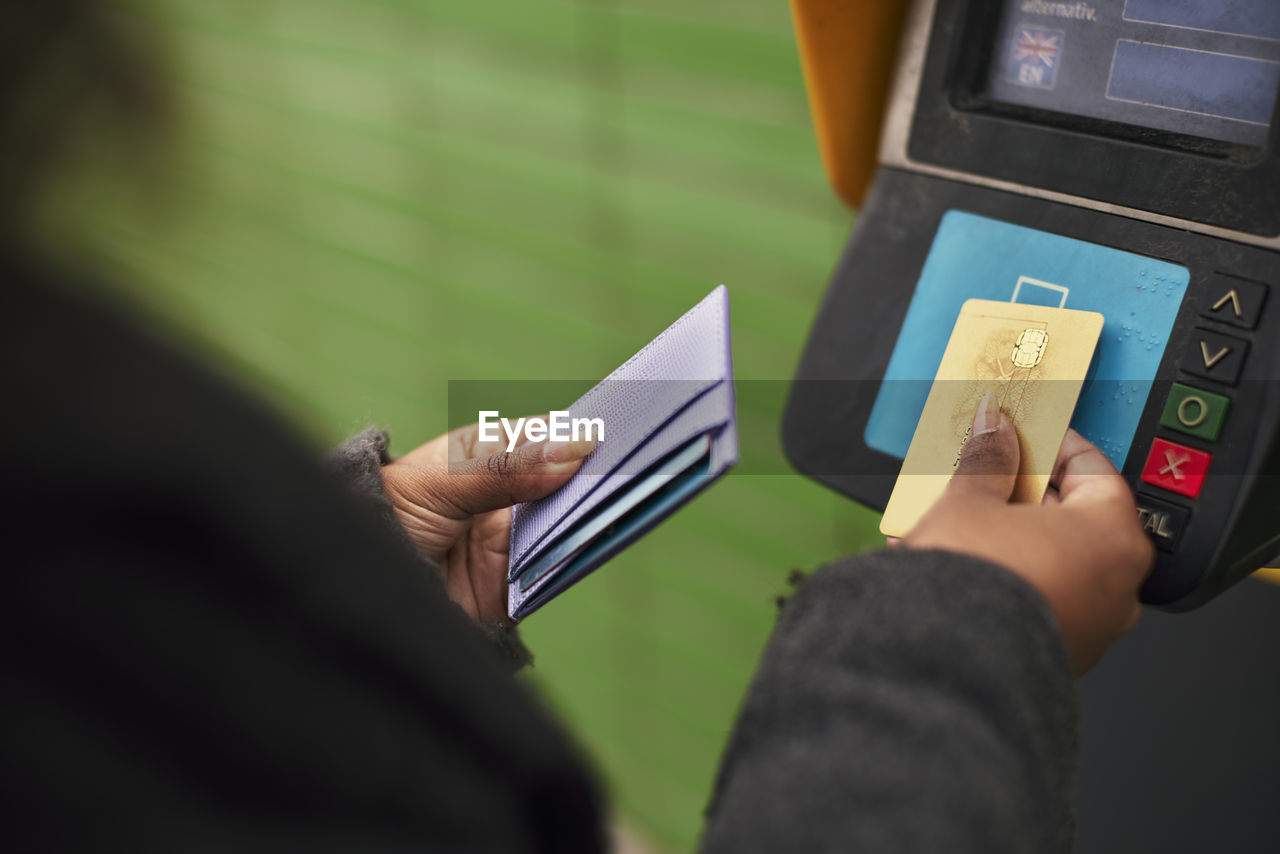 Woman paying for ticket with credit card