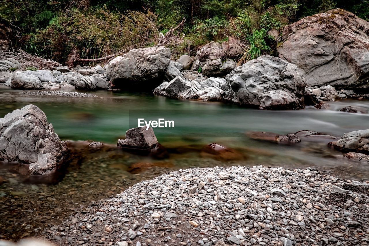 Scenic view of rocks in lake