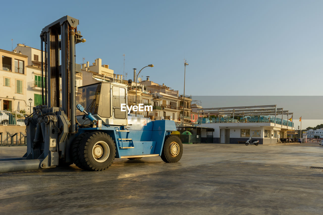 Forklift for taking boats into or out of the water in a marina