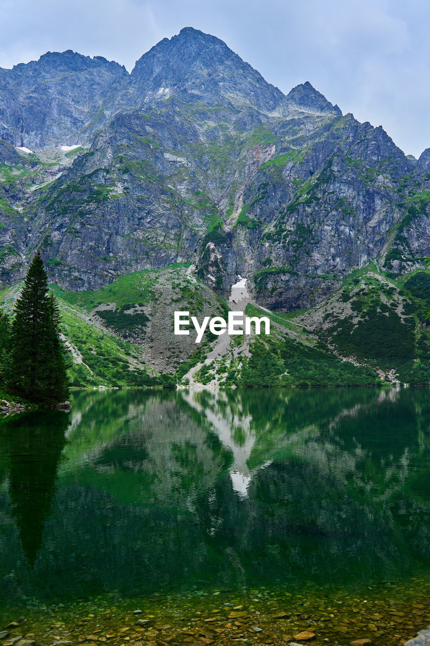 Mountains range near beautiful lake. tatra national park in poland. morskie oko or sea eye lake