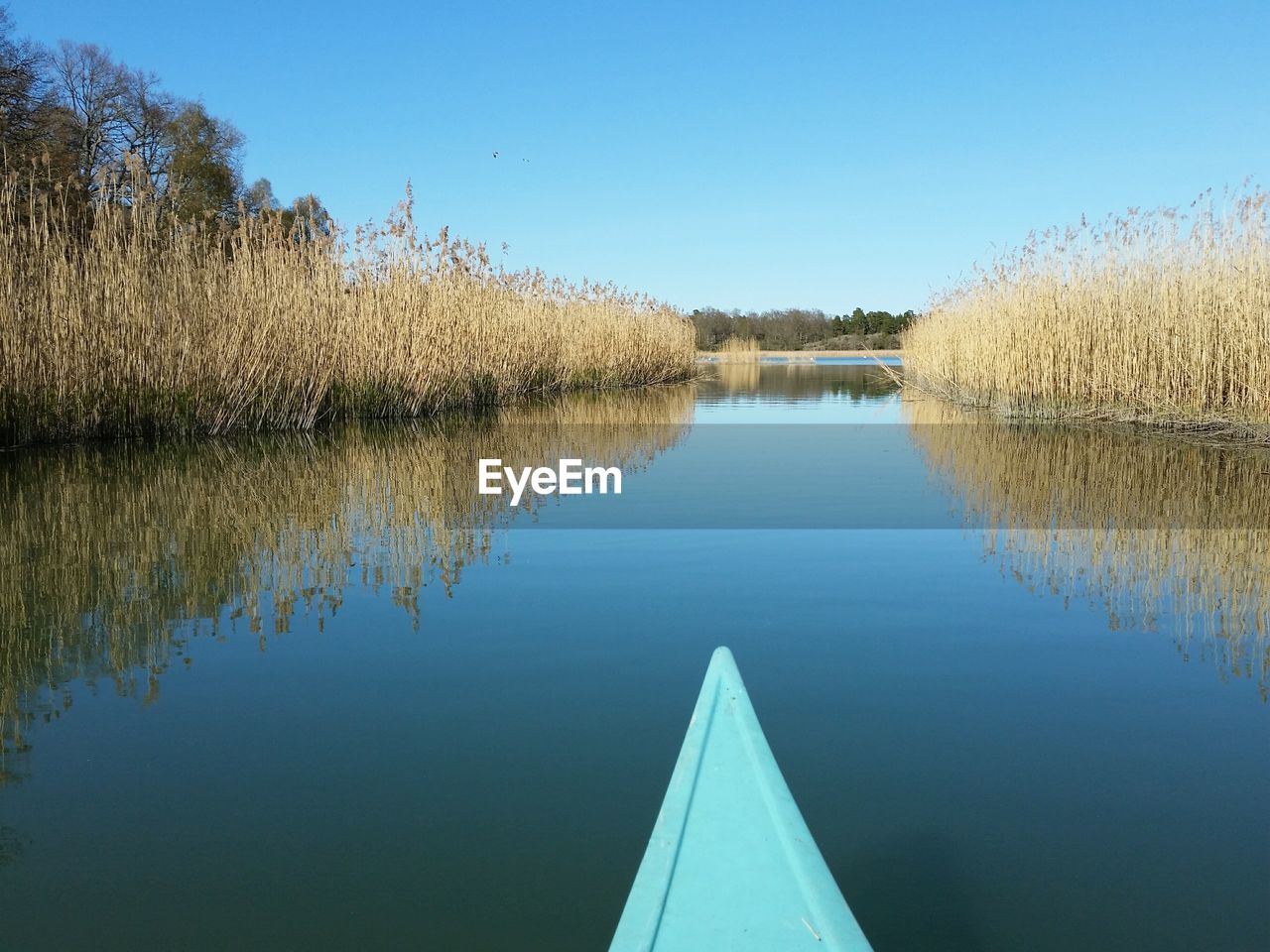 Cropped image of canoe at lake