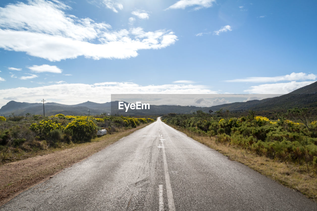 Close-up of road with sky in background