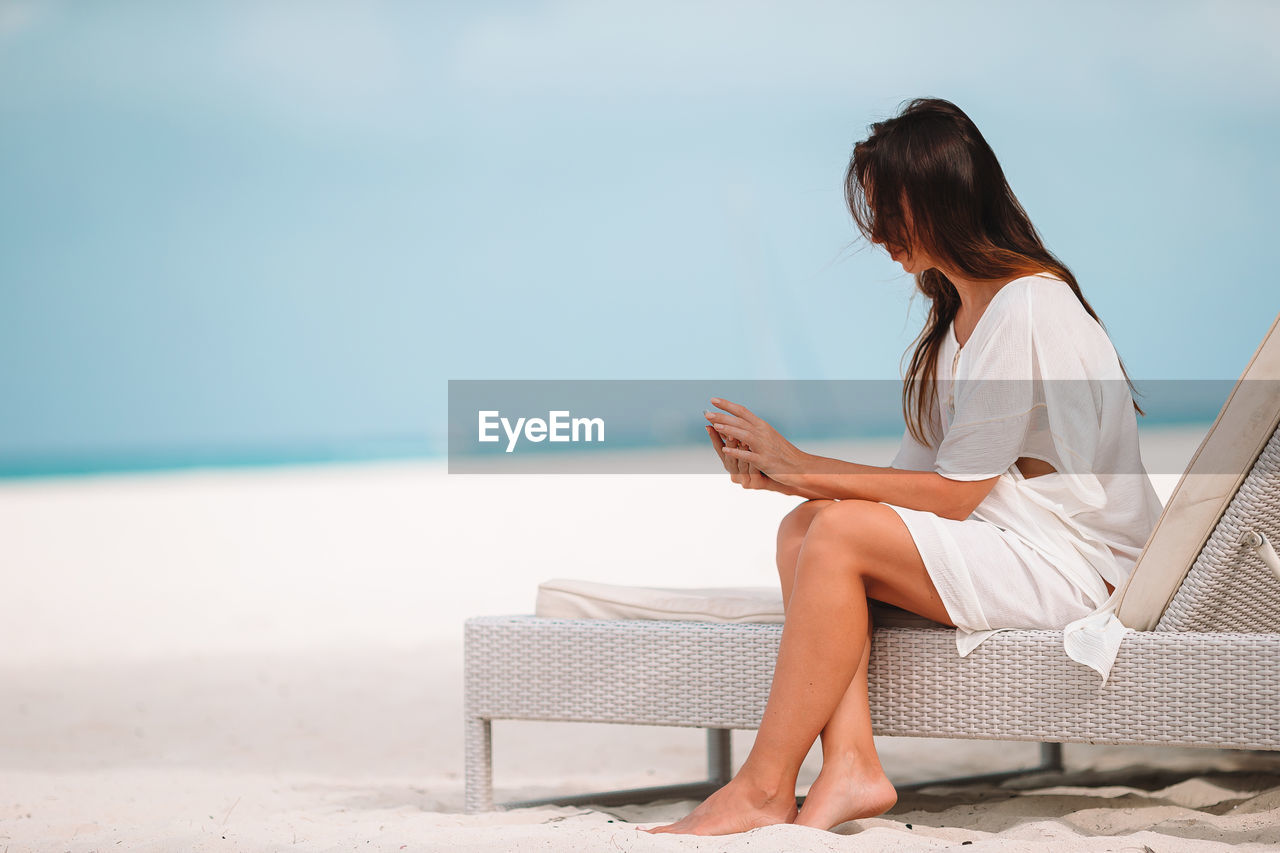 Woman sitting on beach