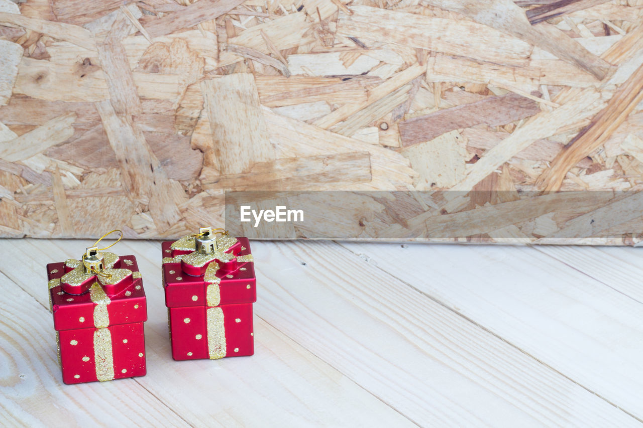 High angle view of red gift boxes on wooden table