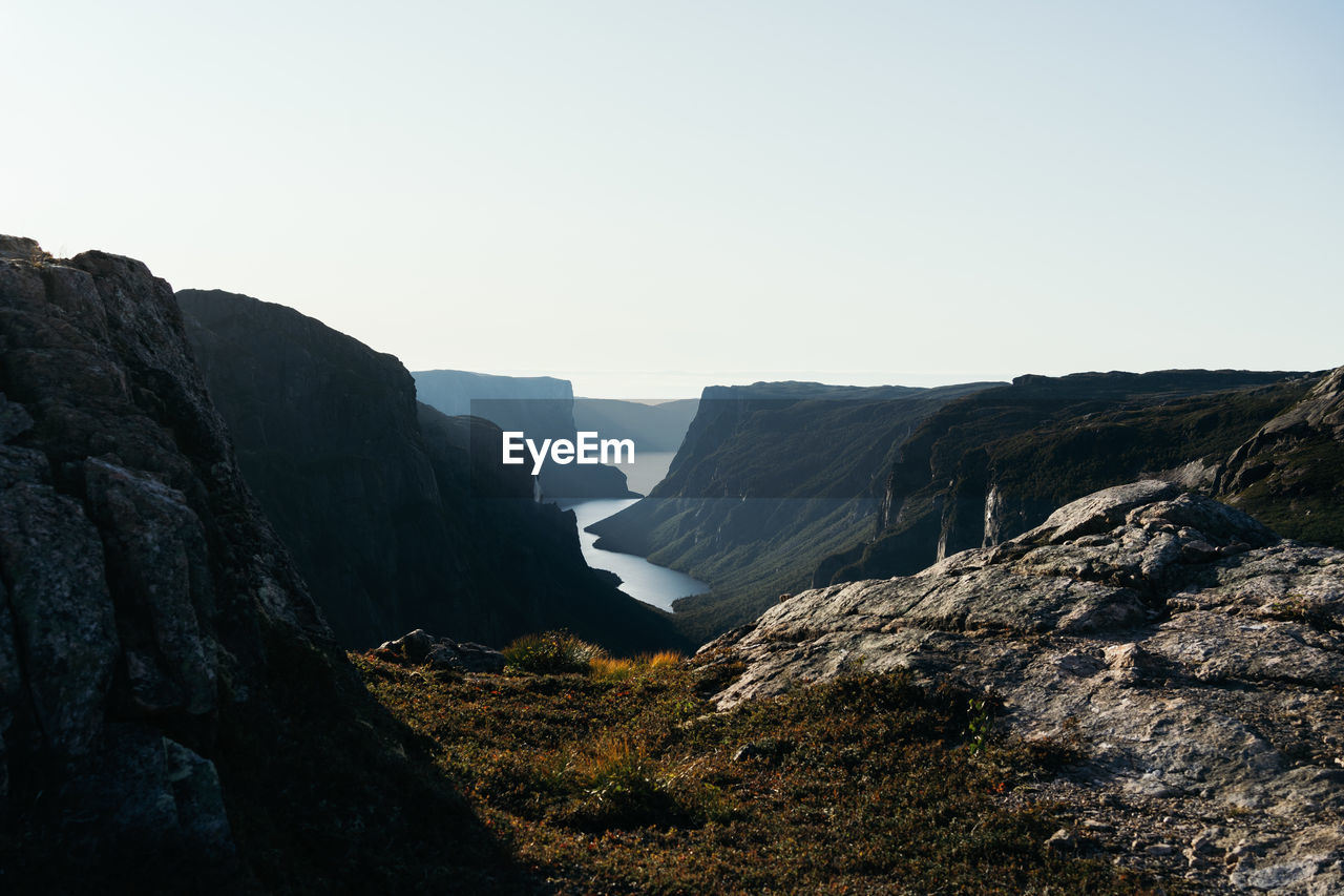 Scenic view of rocky mountains against clear sky