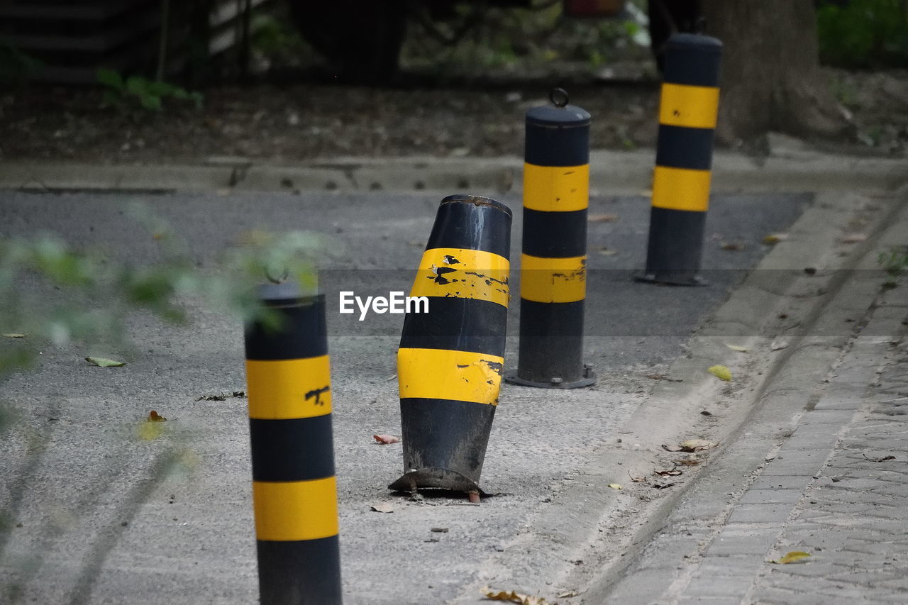 Striped bollards on footpath