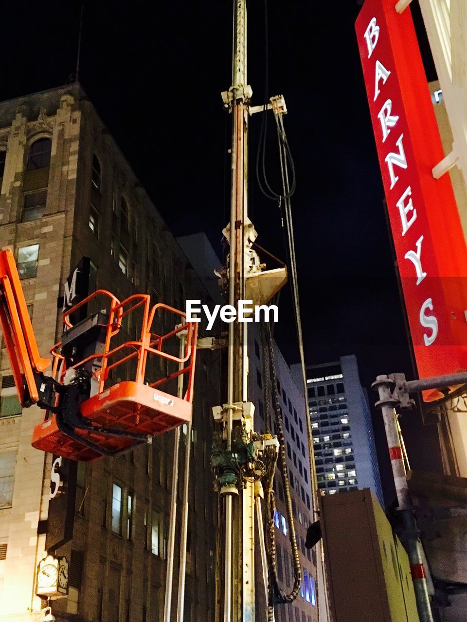 LOW ANGLE VIEW OF BUILT STRUCTURE AT NIGHT