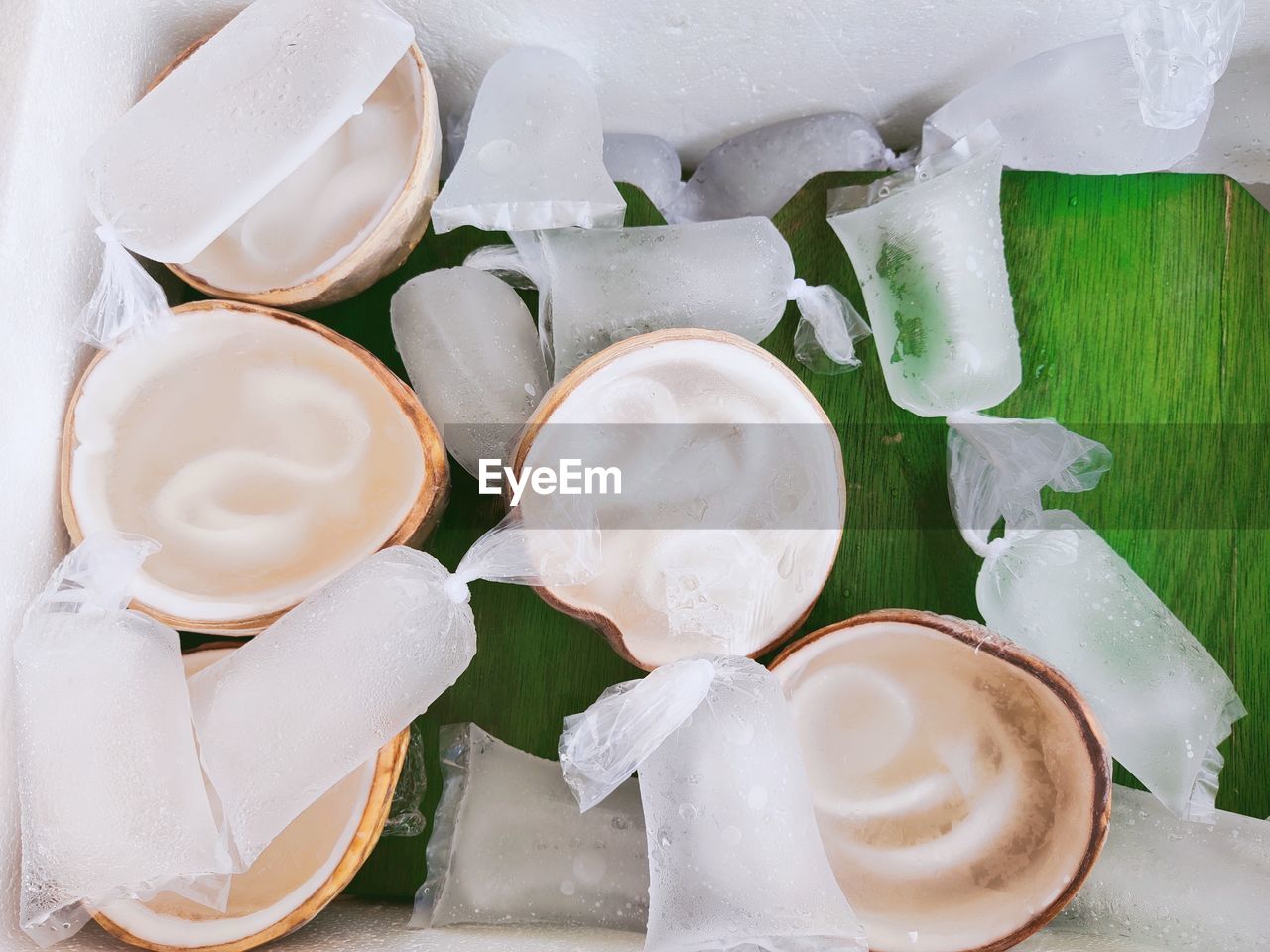 HIGH ANGLE VIEW OF ICE CREAM WITH SPOON AND SAUCE