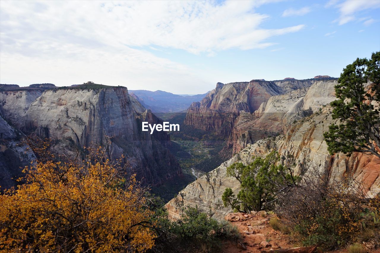 Scenic view of mountain against cloudy sky