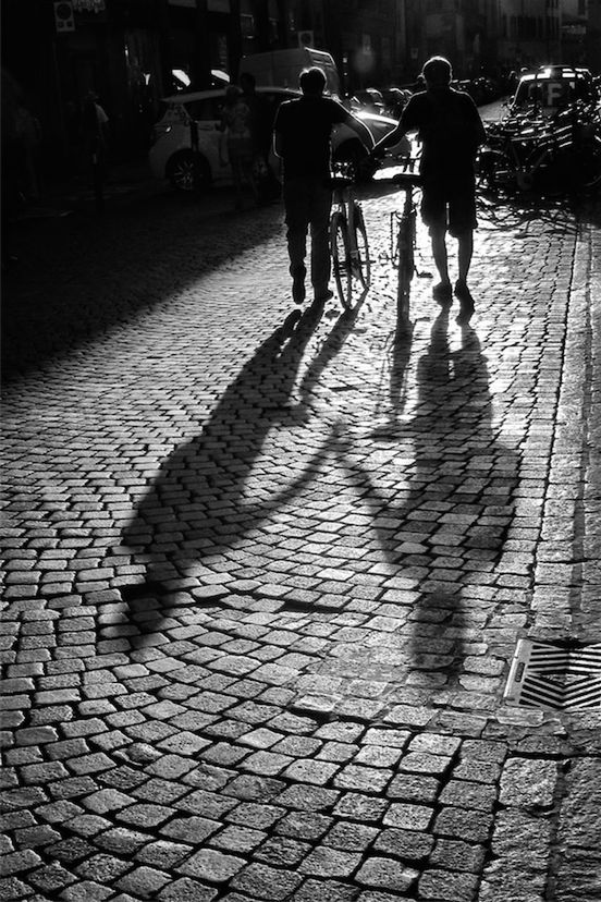 WOMAN WALKING ON SIDEWALK