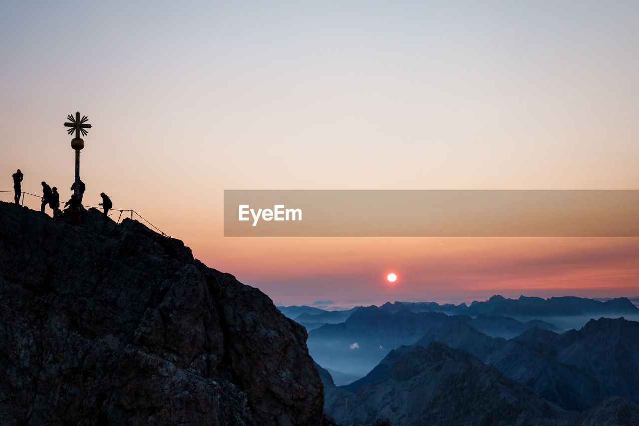 Scenic view of silhouette mountains against sky during sunset