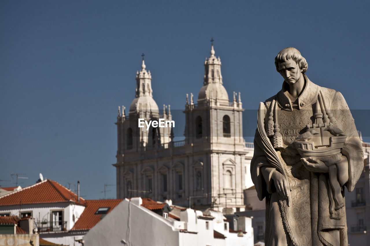 Statue of historic building against clear sky