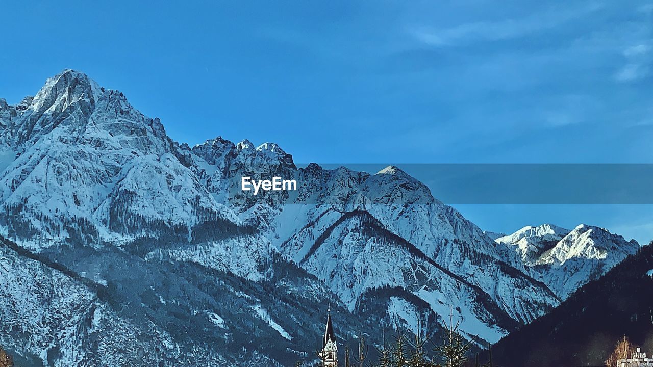 Scenic view of snowcapped mountains against sky