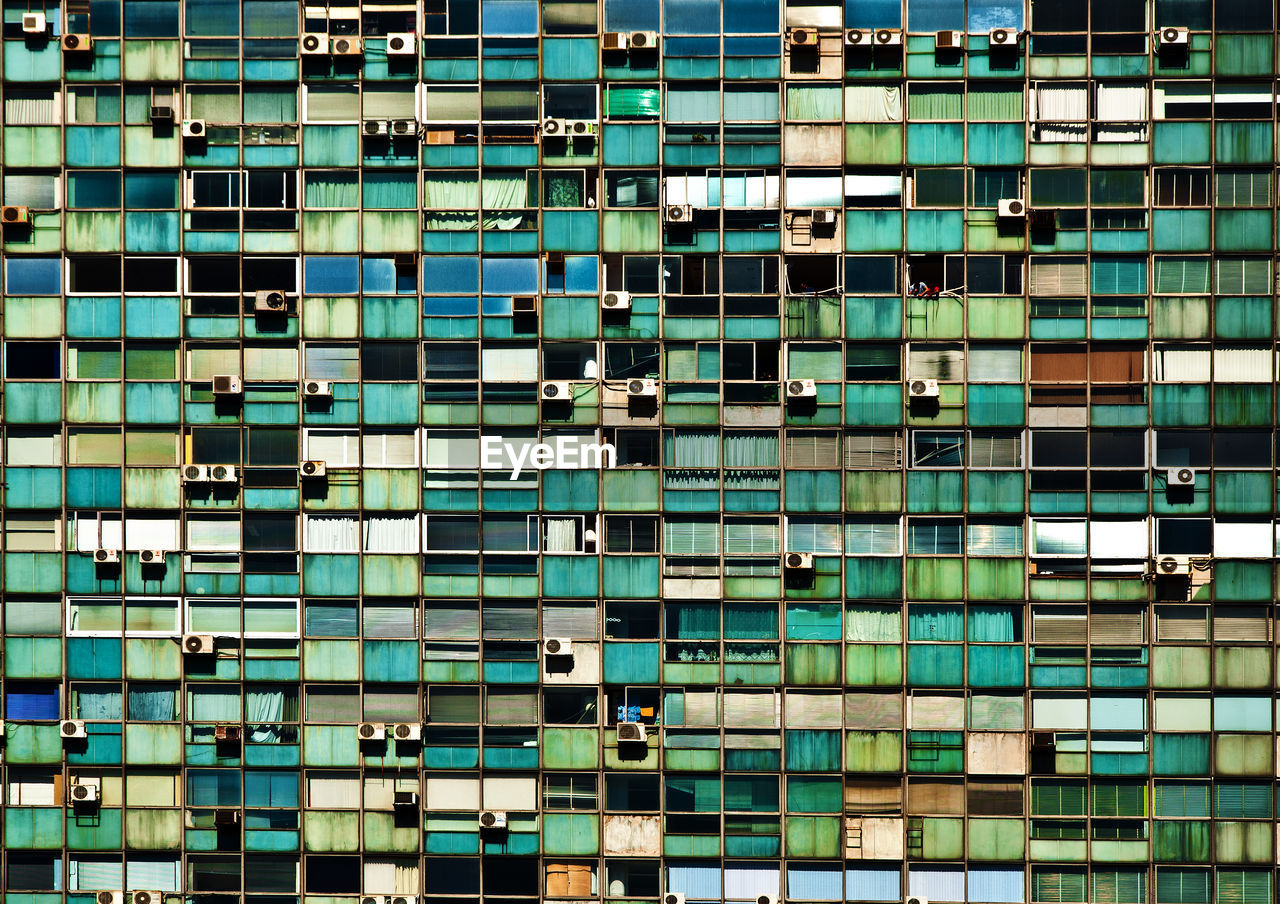 Full frame shot of building window during sunny day