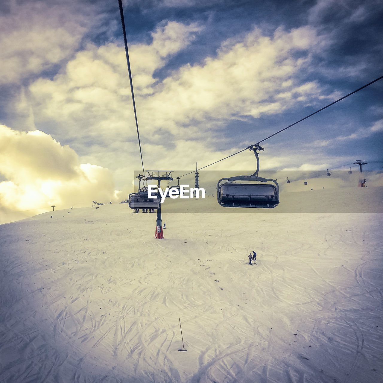 OVERHEAD CABLE CAR IN SNOW COVERED LAND