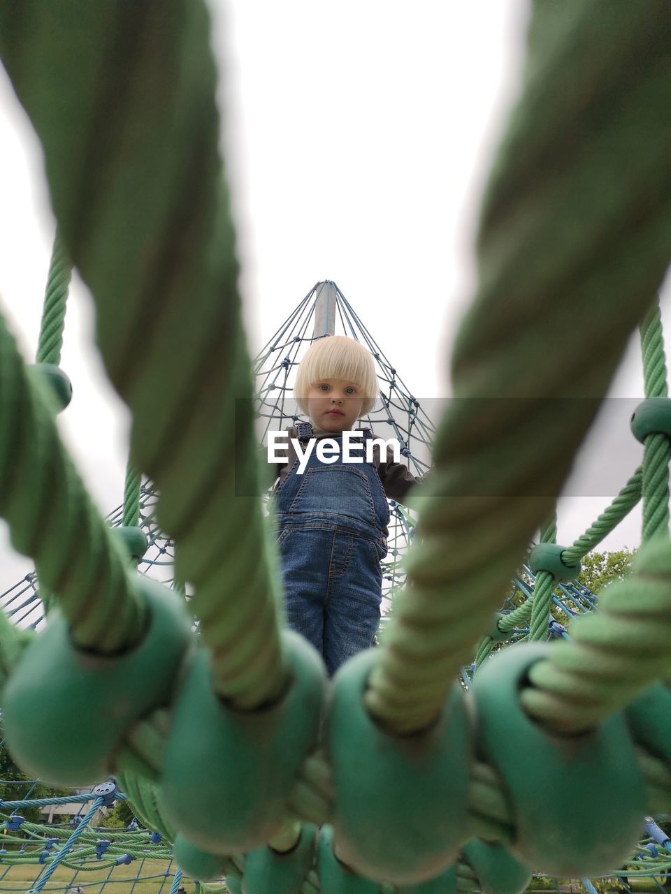 Close-up of cute girl against plants