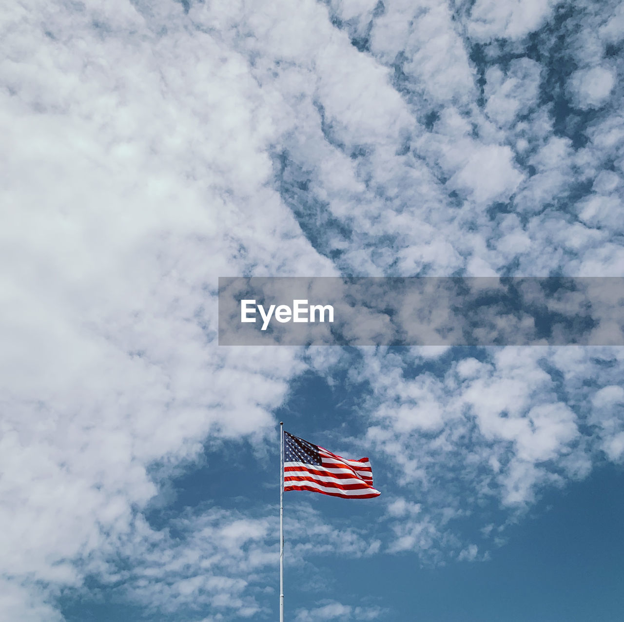 Low angle view of flag against sky