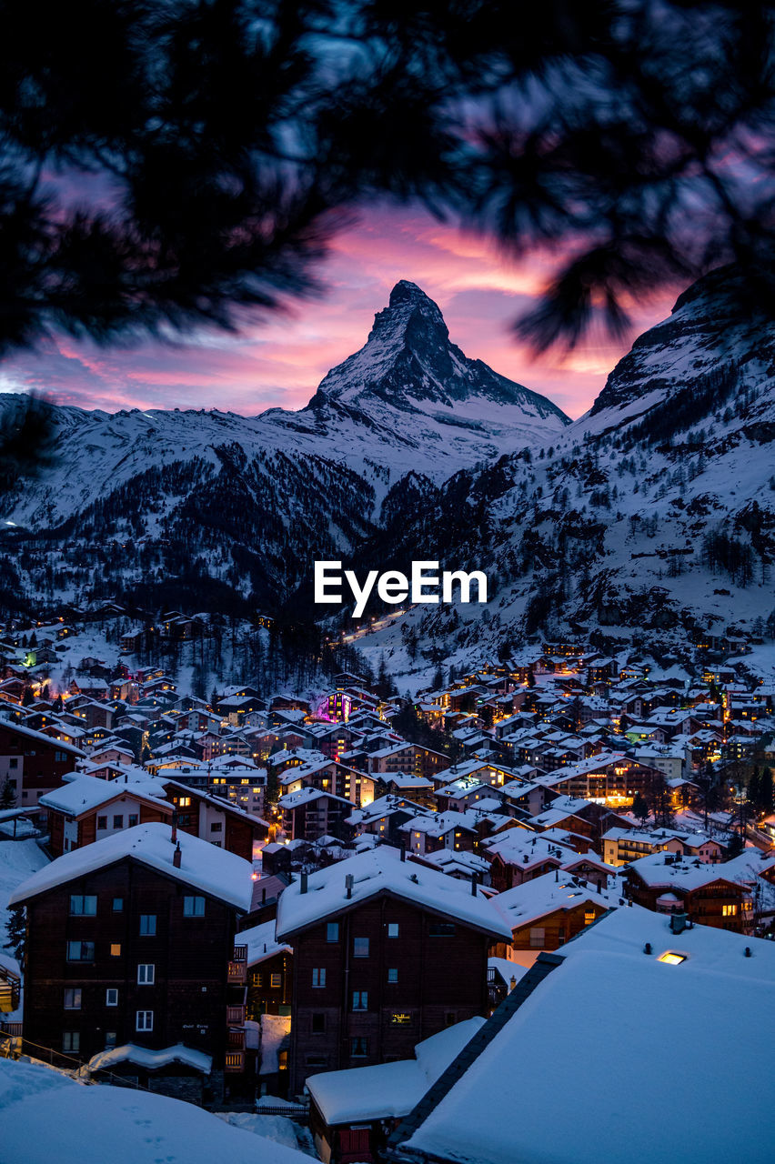 SNOW COVERED HOUSES AND BUILDINGS IN CITY