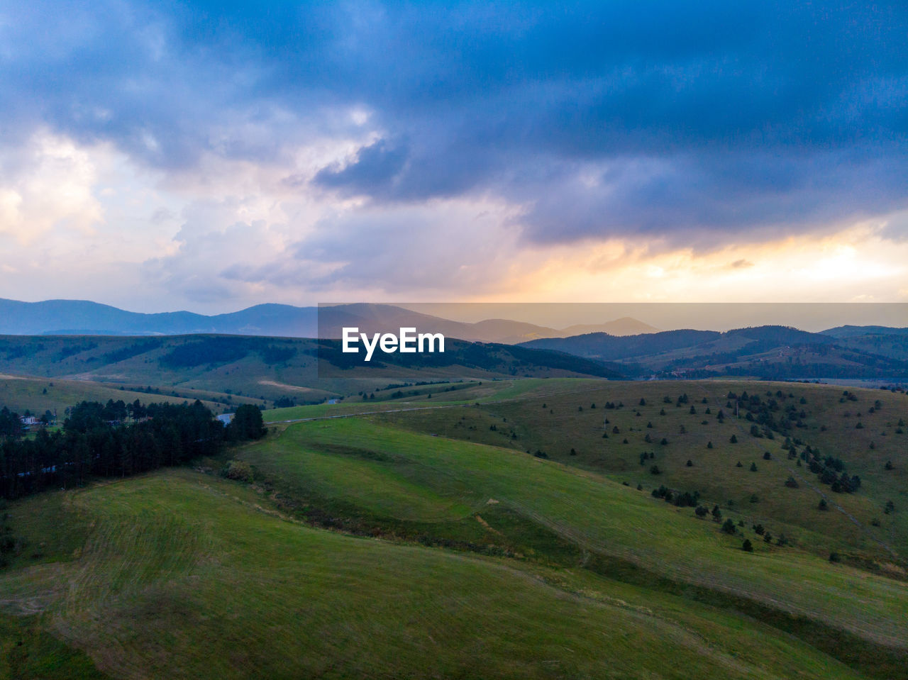 Scenic view of landscape against sky during sunset