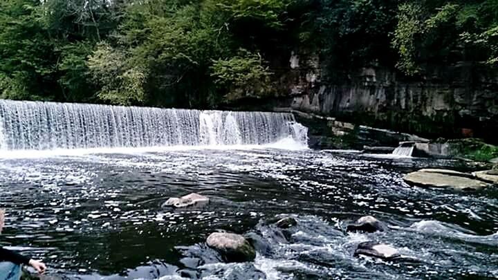 SCENIC VIEW OF RIVER FLOWING THROUGH ROCKS