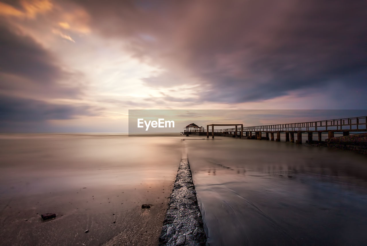 Scenic view of calm sea at sunset