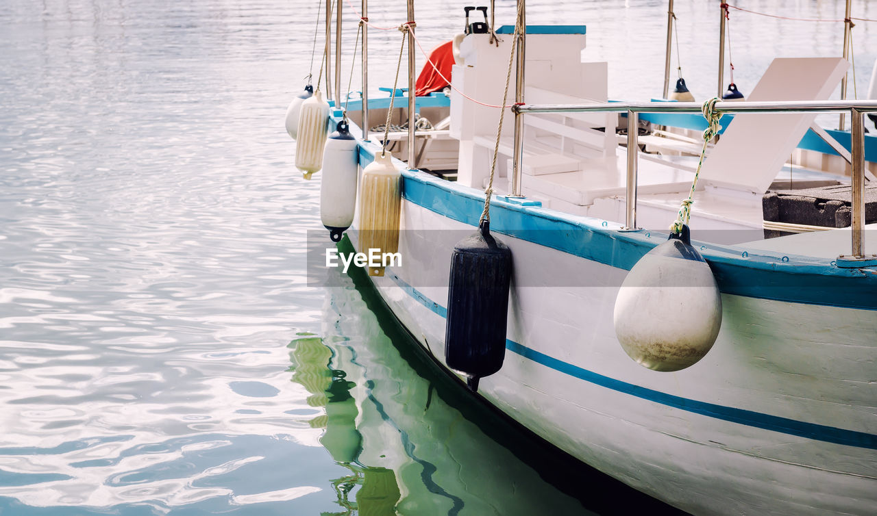 Close-up of boat moored on sea