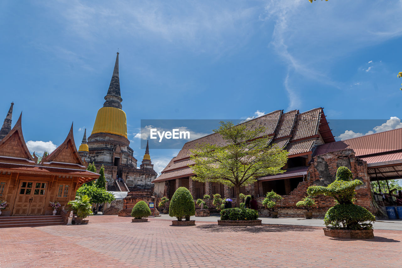 Panoramic view of temple amidst buildings against sky