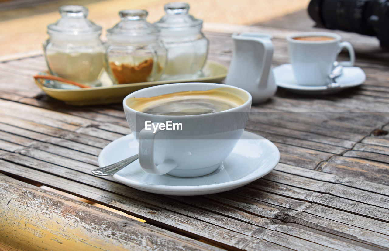 CLOSE-UP OF FOOD ON WOODEN TABLE