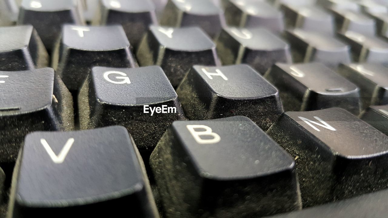 Full frame shot of dusty computer keyboard