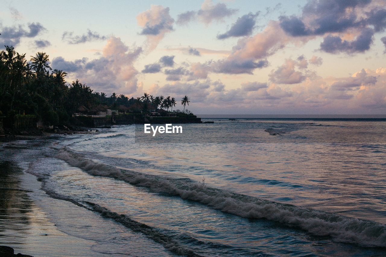 Scenic view of sea against sky at sunset