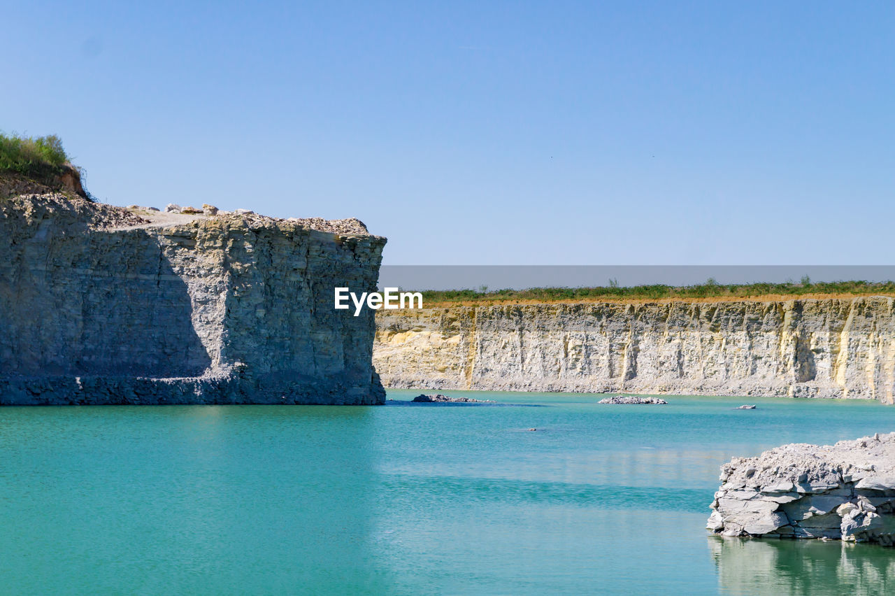 Scenic view of sea against clear blue sky