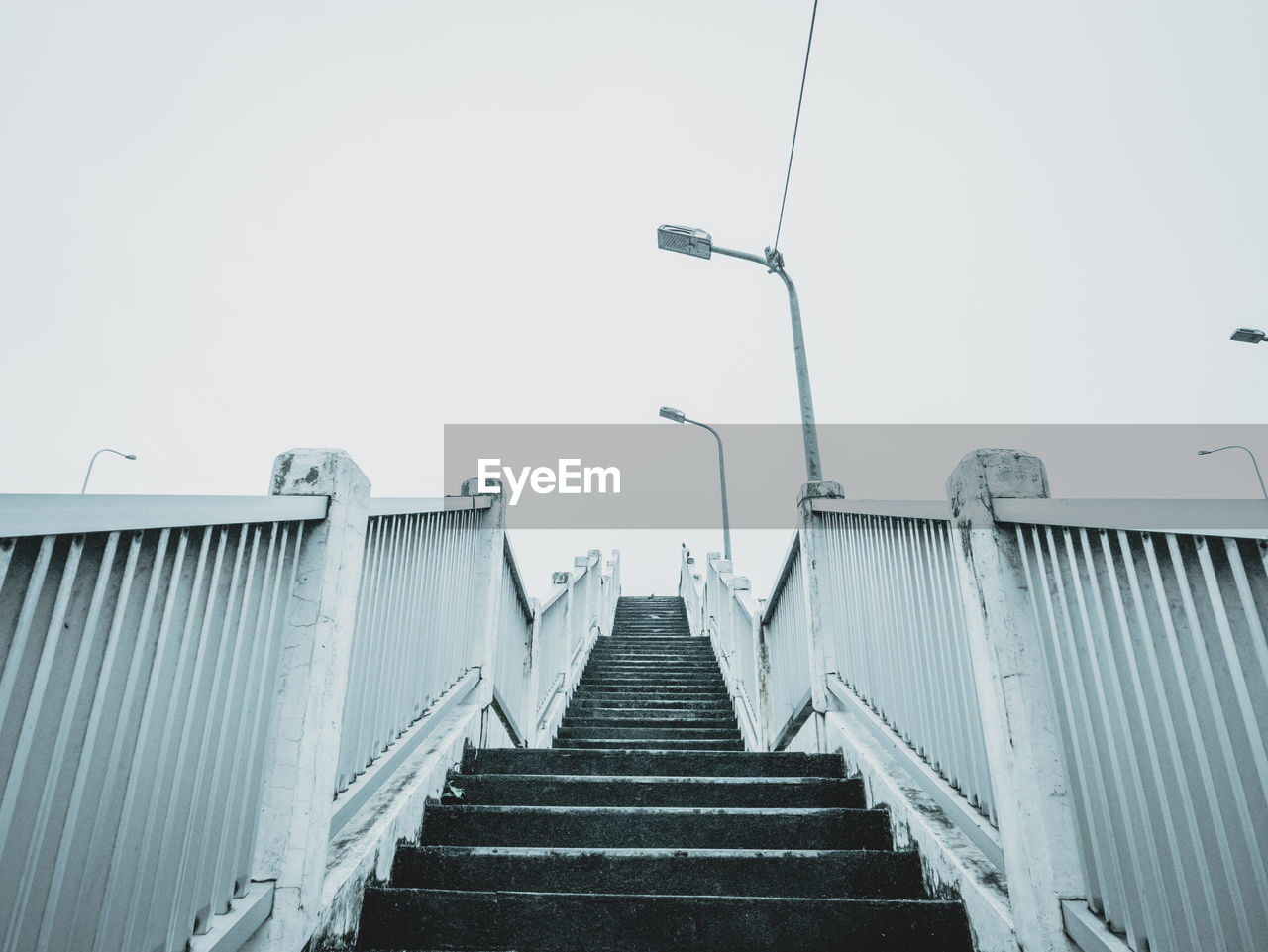 LOW ANGLE VIEW OF STAIRS AGAINST CLEAR SKY