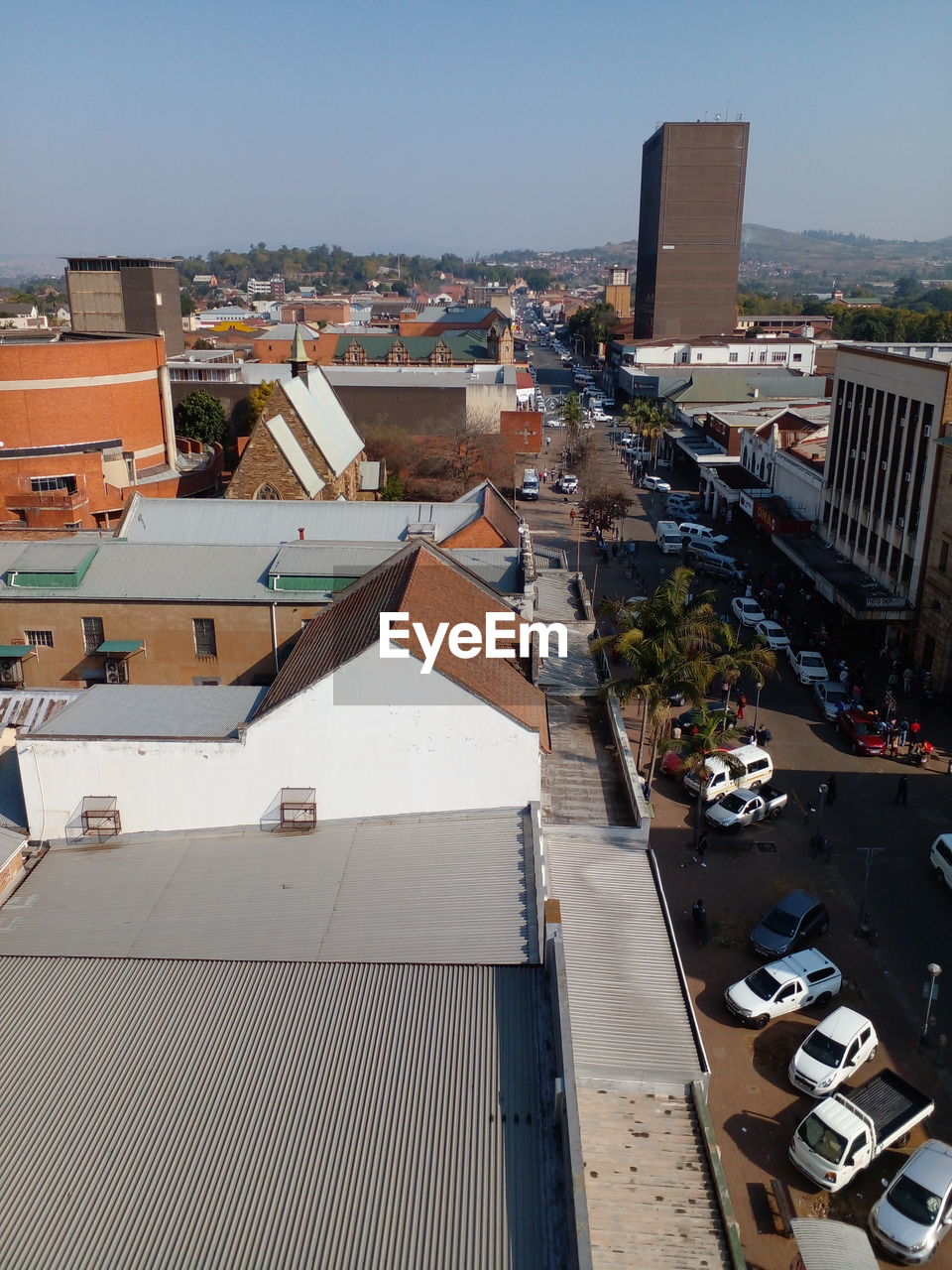 HIGH ANGLE VIEW OF BUILDINGS AGAINST CLEAR SKY