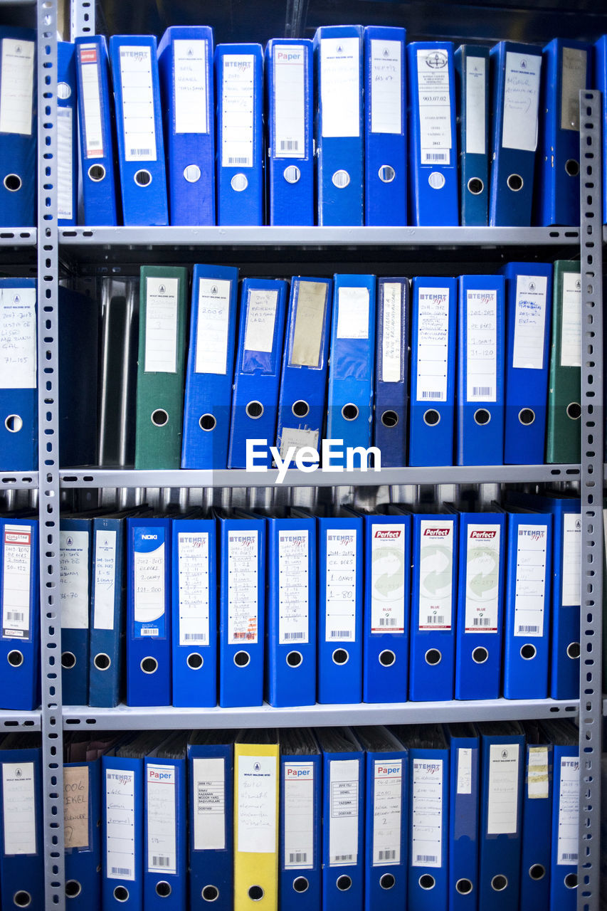 Full frame shot of folders in shelf