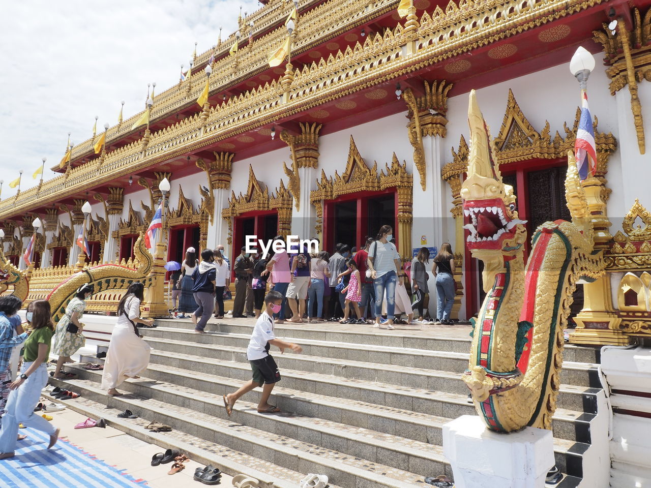 GROUP OF PEOPLE IN TEMPLE