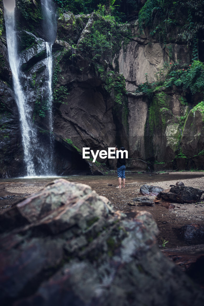 SCENIC VIEW OF WATERFALL