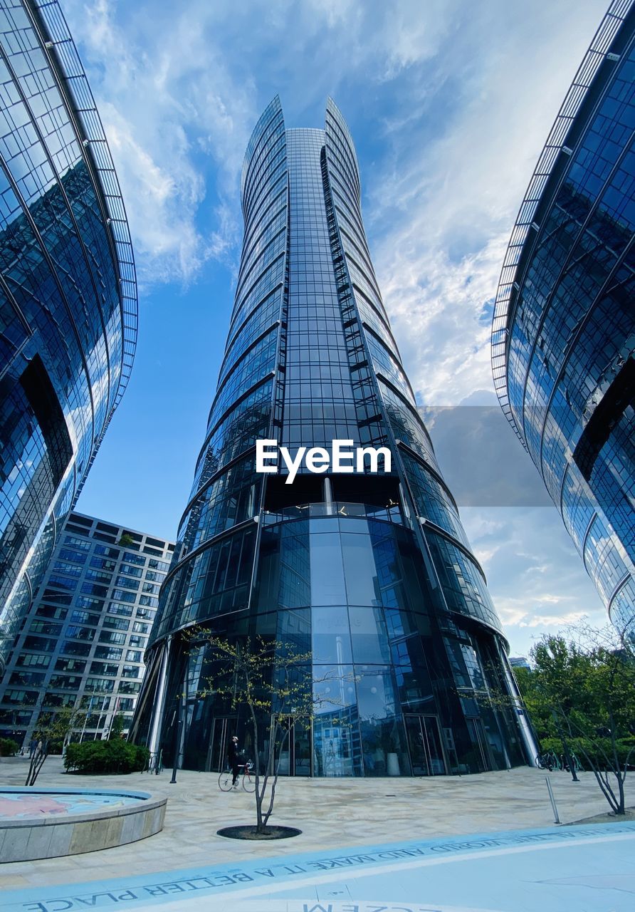 architecture, built structure, city, building exterior, office building exterior, building, blue, landmark, skyscraper, sky, business, office, urban area, glass, metropolitan area, metropolis, nature, reflection, landscape, futuristic, downtown district, tower block, business finance and industry, cloud, cityscape, finance, travel destinations, tower, corporate business, headquarters, facade, construction industry, outdoors, urban skyline, city life, downtown, low angle view, travel, steel, alloy, residential district, industry, no people, finance and economy, day, financial district