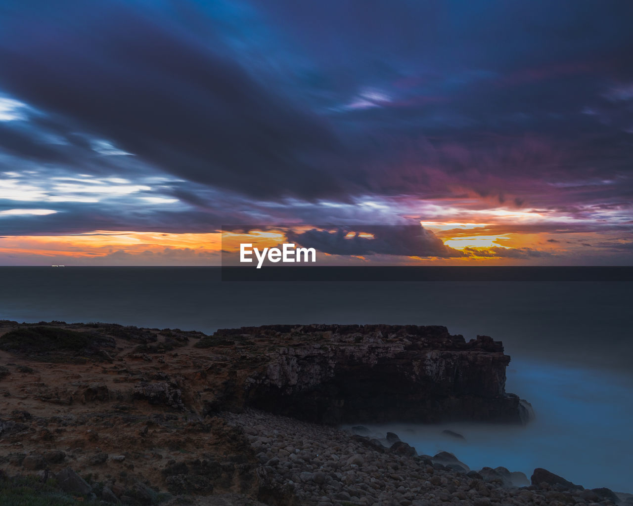 Scenic view of sea against sky during sunset