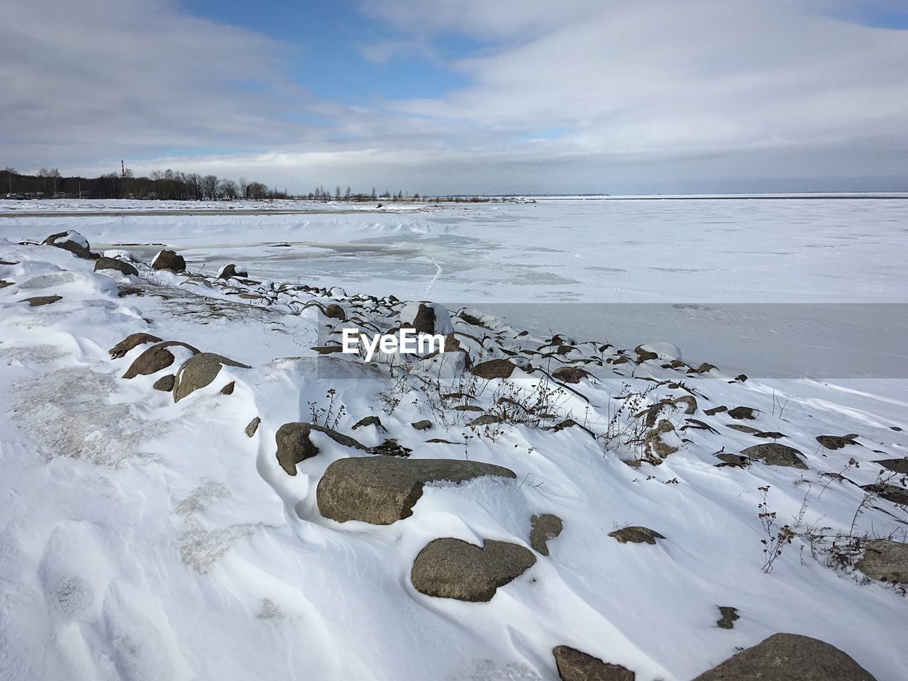 Scenic view of sea against sky during winter