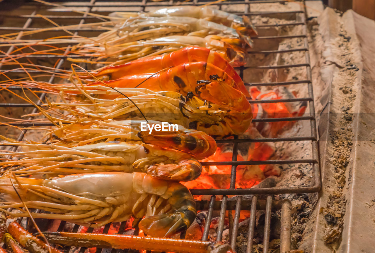 CLOSE-UP OF MEAT ON BARBECUE