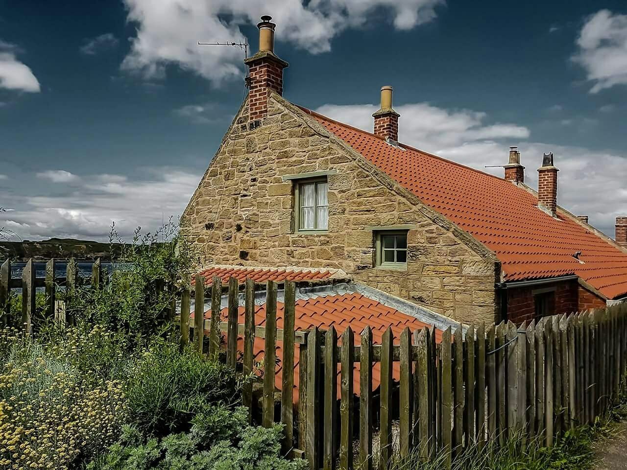 HOUSES AGAINST SKY