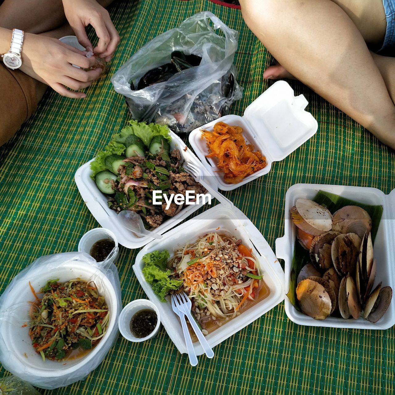 HIGH ANGLE VIEW OF PEOPLE HAVING FOOD