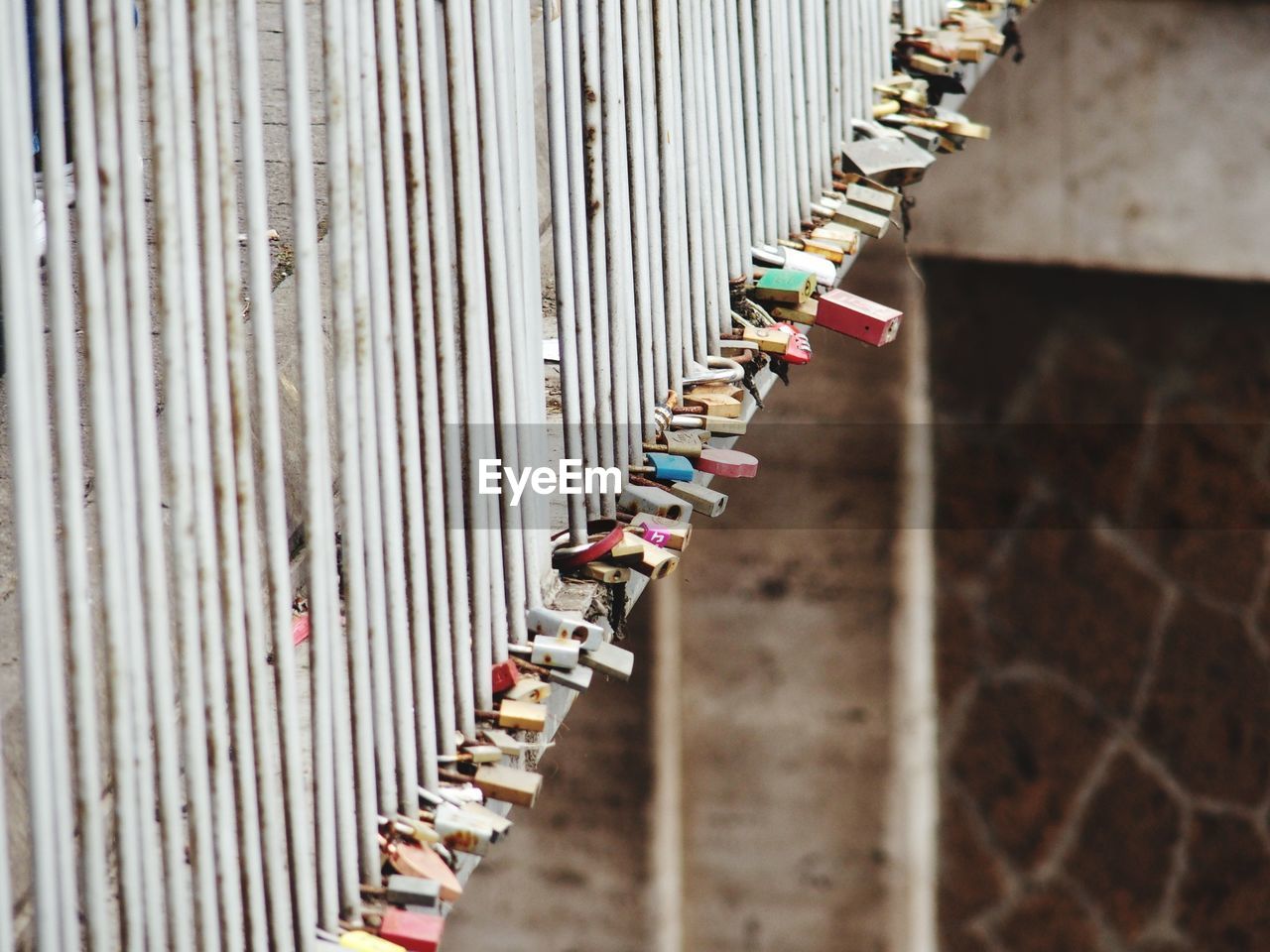 CLOSE-UP OF PADLOCKS ON FENCE