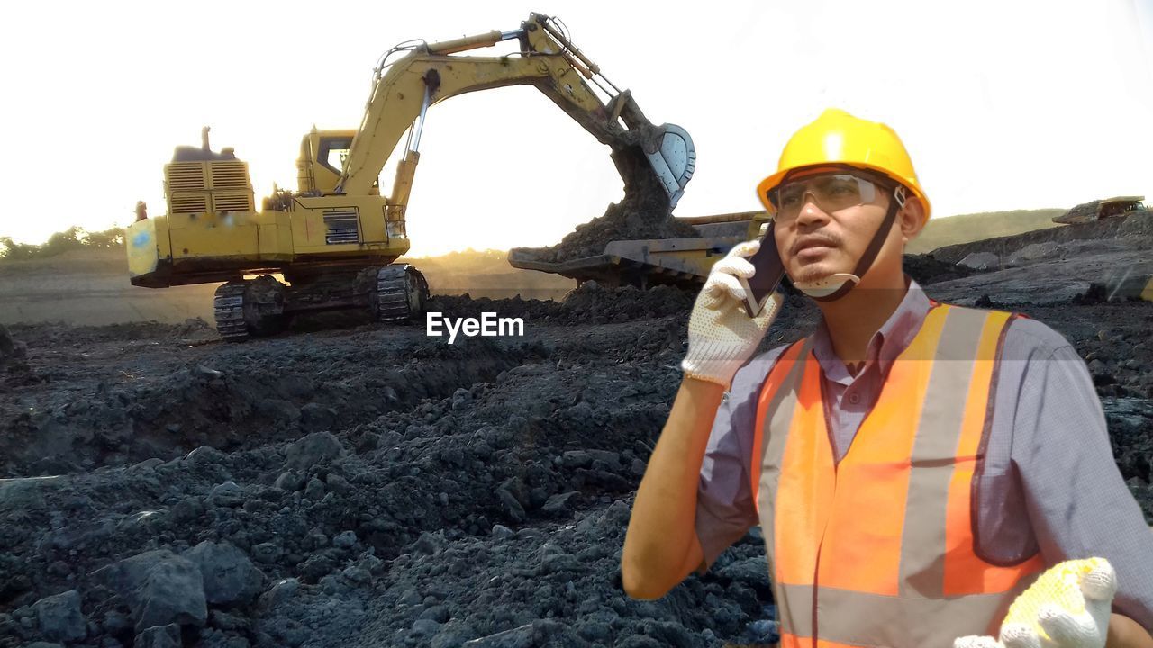 WOMAN WORKING ON CONSTRUCTION SITE