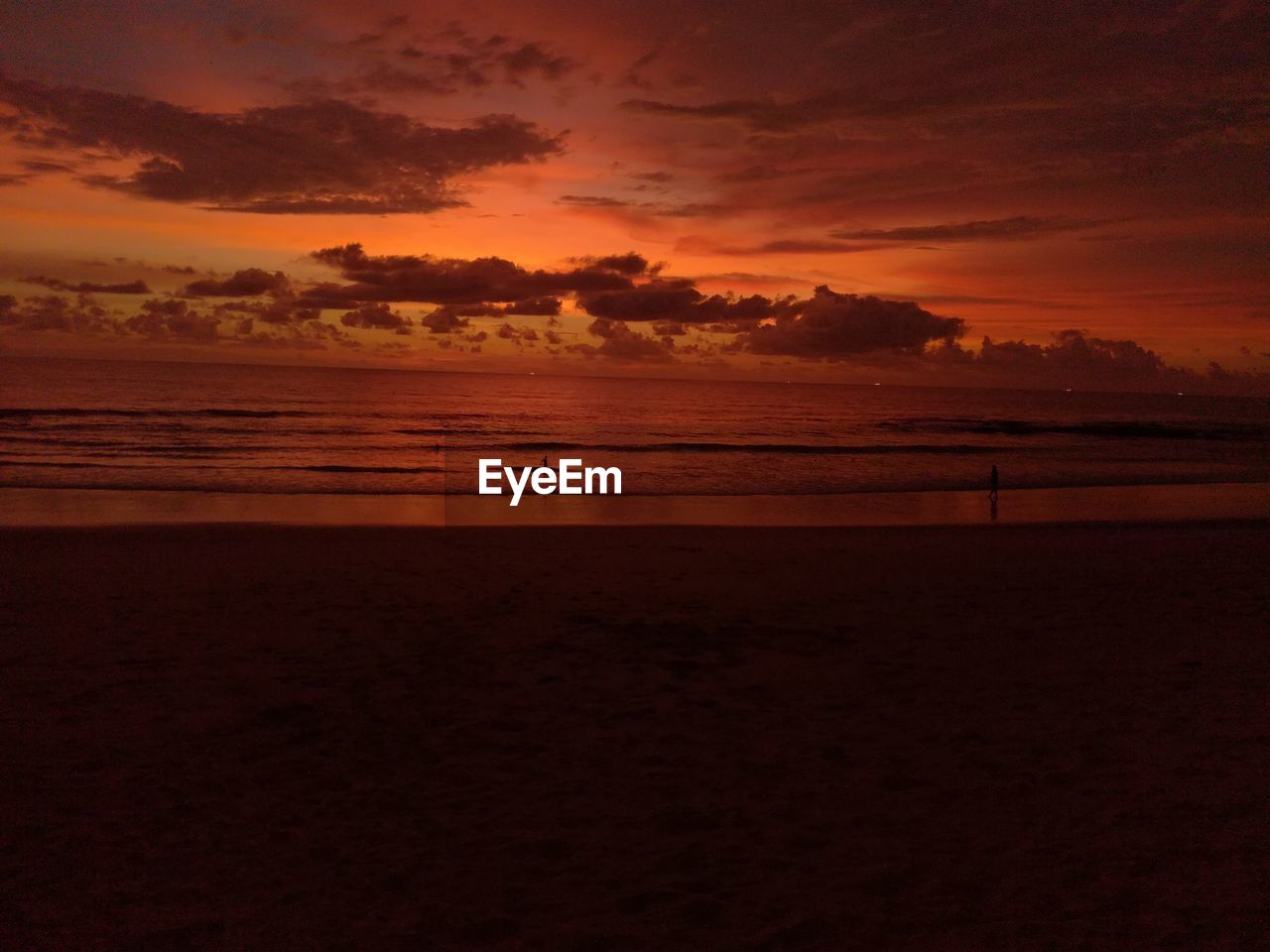 Scenic view of beach against sky during sunset