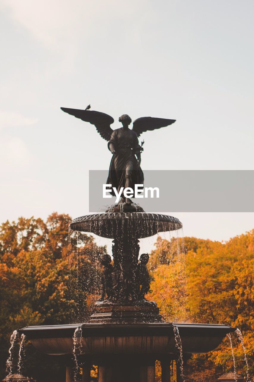 Low angle view of bethesda fountain against sky at central park