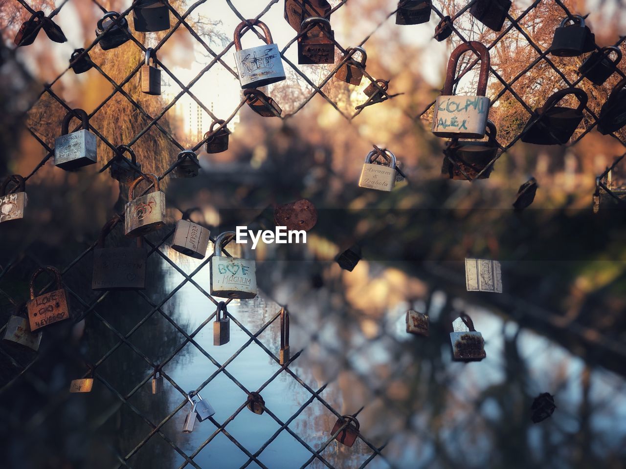 LOW ANGLE VIEW OF PADLOCKS ON FENCE