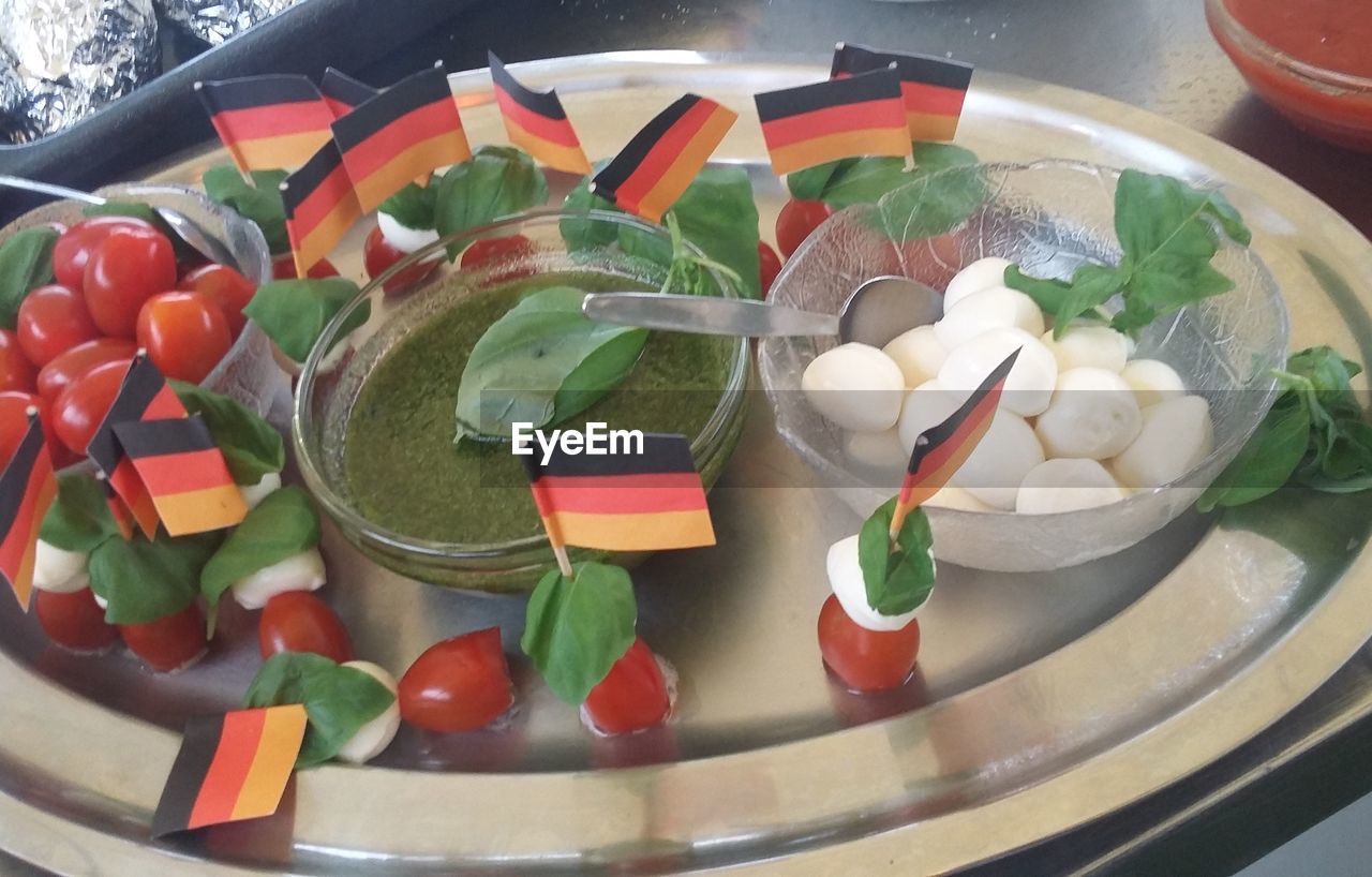 High angle view of mozzarella and vegetables with german flags